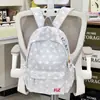 Mochila bordada de estilo universitario americano con adornos de estrellas para estudiantes femeninas, adecuada para estudiantes de secundaria y preparatoria, versátil para uso escolar