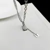 Collar en forma de corazón para hombres y mujeres, collar de acero de titanio con borla, cadena para suéter con colgante apilado de doble capa estilo ins versátil hip-hop personalizado