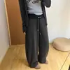 Calça banana de cor contrastante cuidadosamente selecionada feminina outono e inverno nova com cordão drapeado emagrecedor perna larga elegante versátil simples calça de perna curva