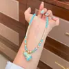 Moda Original Elegante Color Perla Shijia Gota de Aceite Flor de Cuatro Hojas Calabaza Collar Lujo Ligero Nicho Todo Fósforo Cadena de Lana