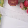 Venta al por mayor del fabricante Yiwu Trading presenta nuevos accesorios de encaje con flecos, accesorios para la ropa y encaje de borlas coloridas para cortinas