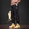 Pantalones de trabajo estilo americano para hombre al por mayor de fabricante, comercio exterior, corte holgado vintage, talla europea, pantalones jogger versátiles casuales para primavera y otoño