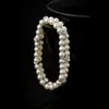 Pulsera de Doble Capa con Perlas y Zirconias Europeas y Americanas Transfronterizas con un Diseño Único, Joyería de Mano Exquisita y Versátil para Mujeres