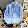 Tendencia de moda 2026 camisa azul de manga larga para hombre, verano, única y de nicho, ropa de hombre de alta gama, camisa de cuello mao deconstruida