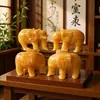 Al por mayor Topacio de Arroz Natural Elefante Adornos Tallado en Jade Adornos de Jade Jade Absorbente Ruyi Elefante Sala de Estar Adornos para el Hogar