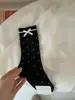Nuevos calcetines de otoño IOULOR de lunares con lazo, calcetines holgados transpirables versátiles estilo coreano para niñas, calcetines sin costuras