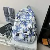 Mochila moderna con graffiti para hombre, adecuada para estudiantes de secundaria, preparatoria y universidad; Mochila de viaje elegante de gran capacidad para mujer