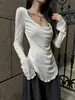 Camiseta blanca de manga larga con volantes irregulares para mujer, nuevo diseño nicho de principios de otoño, entallada a la cintura, top de alta gama, estilo ins