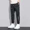Calças Cargo de Primavera e Verão para Homens, Marca da Moda Casual Soltas Plus-Size Calças Cropped, Versátil Camuflado Estilo Coreano Calças Jogger da Moda