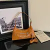 Comercio exterior al por mayor moda cremallera personalizada 2026 nuevo diseño PU retro estético encerado bandolera de un solo hombro para debajo del brazo