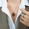Moda Elegante Natural Estilo Tailandés Nanyang Colgante Ojo de Tigre Collar de Acero de Titanio Joyería con Cadena de Lana Otoño e Invierno