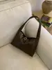 Bolso de axila de cuero suave retro para mujer 2025 Otoño e Invierno Nuevo de gran capacidad Bolso de hombro simple Bolso baguette de mano