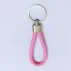 Nuevo llavero de cuerda de cuero tejido, llavero colgante creativo para mochila, llavero para empujar, pequeño regalo, llavero para coche al por mayor
