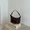 Bolsa transfronteriza de gran capacidad, nuevo modelo otoño 2026, bolso de hombro único para debajo del brazo, bolso cruzado tipo albóndiga simple vintage de alta calidad