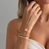 Pulsera de cruz colgante hip-hop ins transfronteriza europea y americana, joyería de cadena de hueso de serpiente metálica con cuentas CCB personalizada