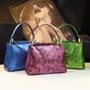 Bolso de mujer de lujo ligero de nicho de alta gama, artesanía láser, bolso de cuero genuino, versátil para el trabajo, estampado de serpiente, bolso de hombro cruzado, moda
