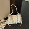 Nuevo bolso de hombro para mujer primavera-verano, bolso cruzado tipo cubo ligero con patrón de diamantes, nicho de lujo gran capacidad 2026