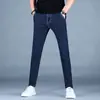 Jeans masculino de alta qualidade, marca da moda, nova coleção outono 2026, azul, corte slim, elástico, calça comprida masculina