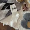 Novas meias femininas de outono e inverno com laços grandes, meias caneladas de cor sólida até o meio da panturrilha, sem costura e versáteis, meias cinzas estilo coreano