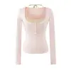 Atacado de roupas femininas estilo europeu e americano Ins, nova coleção de outono, conjunto estiloso de camisole acolchoado e conjunto de duas peças de camiseta justa