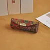 Estuche de regalo portátil estilo chino para lápiz labial, sencillo y elegante, con espejo, plegable y a prueba de polvo.