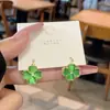 Aretes de Flor de Trébol de Cuatro Hojas Fresca Estilo Mori de Alta Calidad Dulces de Doble Cara Piedra Ojo de Gato Pendientes Versátiles