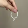 Mini Labubu Cuarta Generación Caja Sorpresa Ropa de Muñeca Collar Colgante Labubu 26 Letras Collar de Perlas Accesorios de Joyería