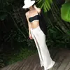 Nuevo bikini sexy de contraste blanco y negro transfronterizo europeo y americano con falda de red para vacaciones en la playa, traje de baño de dos piezas para mujer