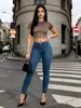 Jeans pitillo elásticos de cintura media lavados básicos europeos y americanos, corte ajustado y levanta glúteos, directo de fábrica