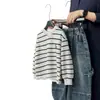 Sudadera Estilo Primavera y Otoño para Niños 2026 Nuevo Estilo Niño Rayas Estilo Coreano Falso Dos Piezas Camiseta Base para Niños Medianos y Mayores Top de Otoño
