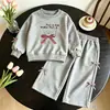 Comercio Exterior Niños Más Vendido Conjunto de Primavera y Otoño para Bebé 2026 Nuevo Estilo Niños Sudadera Elegante con Lazo Pantalones de Pierna Ancha Niña