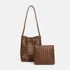 2026 Novo Estilo de Férias de Outono e Verão Bolsa Tecida Vazada Retrô de Couro Macio Bolsa de Mão Cesta Tote Bolsa de Ombro Único Mãe-Filha