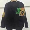 Cardigan de Tricô Versátil Estilo College Soltinho com Desenho de Urso Outono e Inverno Jaqueta Suéter Suéter Cartoon Tendência Europeia e Americana Feminino