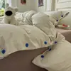 2026 Novo Conjunto de Roupa de Cama de Algodão Lavado Conjunto de Quatro Peças Estilo Muji Listrado Botão Tecido Colorido Jacquard Casa Quarto Conjunto de Quatro Peças