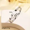 Pulsera de titanio y acero de alta gama transfronteriza con diamantes pulsera de acero inoxidable oro real de 18k galvanizado en horno pulsera abierta para mujer