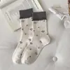 Calcetines de otoño e invierno estilo japonés con lazo floral hasta la mitad de la pantorrilla, calcetines holgados de tela a rayas dulces y modernos para mujer, venta al por mayor de la industria del calcetín de Zhuji