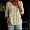 Nova camisa feminina de manga comprida com botões e gola V estampada transfronteiriça, elegante e estilosa para o trabalho, top casual único e moderno