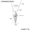 Collar apilado de doble capa Oumika con colgante de concha hueca de acero inoxidable Joyería de playa oceánica de lujo ligero que no se decolora