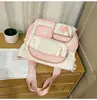 Mochila de estilo japonés ins, nueva, de alta apariencia, colores frescos y dulces en bloques de color, para estudiantes de secundaria y preparatoria, mochila ligera de viaje