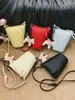 Bolsa Pequeña para Mujer de Marca Extranjera Súper Popular Modelo Nuevo 2026 Bolso para Teléfono de Nicho Bolso Cubo Bolso de Hombro Cruzado Versátil y Elegante