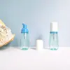 Botella cónica translúcida verde PET de 60 ml en stock, botella dispensadora de espuma para limpiador facial, botella dispensadora tipo prensa para pasta de dientes