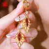 Brinco de Argola Francês Exquisito e Elegante Retrô Pedra Olho de Gato Folha Moda Elegante Versátil Celebridade da Internet Popular Moda Joia de Orelha