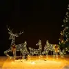 Escena navideña transfronteriza de arte en hierro con renos luminosos tirando de un trineo, arreglo combinado para decoraciones de centros comerciales y decoración de hoteles