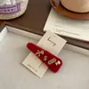 Invierno Nuevo Felpa Pony Dorado Bolsa de la Suerte Triángulo Pinza para el Cabello Pasador Elegante Pinza para el Cabello Roja de Gama Alta