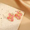 Los pendientes de acero inoxidable esmaltado más vendidos de Temu para mujer, pendientes de acero de titanio de cuatro pétalos de gama alta de nicho