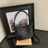 Bolso bandolera para mujer de gran capacidad 2026 nuevo estilo moderno sensación de alta gama bolso retro bolso de hombro único para mujer bolso tipo cubo versátil