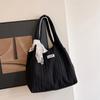 Bolso de gran capacidad para mujer, otoño e invierno, combinable con todo, nuevo estilo 2025, bolso de tela sencillo para el hombro, estilo informal, bolso de mano de clase.