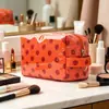 Nueva Bolsa de Cosméticos de Gran Capacidad para Viajes Transfronterizos, Bolsa para Productos de Cuidado de la Piel, Diseño Portátil, Bolsa para Guardar Labiales, Bolsa Rayada para Mujer