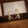 Pendientes Coreanos Nuevos de Lazo Completamente de Diamante Diseño de Nicho de Gama Alta Simples Elegantes Versátiles Pendientes para Mujer