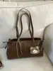 Bolsa de Ombro Estilo Retro para o Dia a Dia Feminina 2025 Outono Nova Moda de Nicho Bolsa de Mão Estilosa Casual Bolsa de Ombro